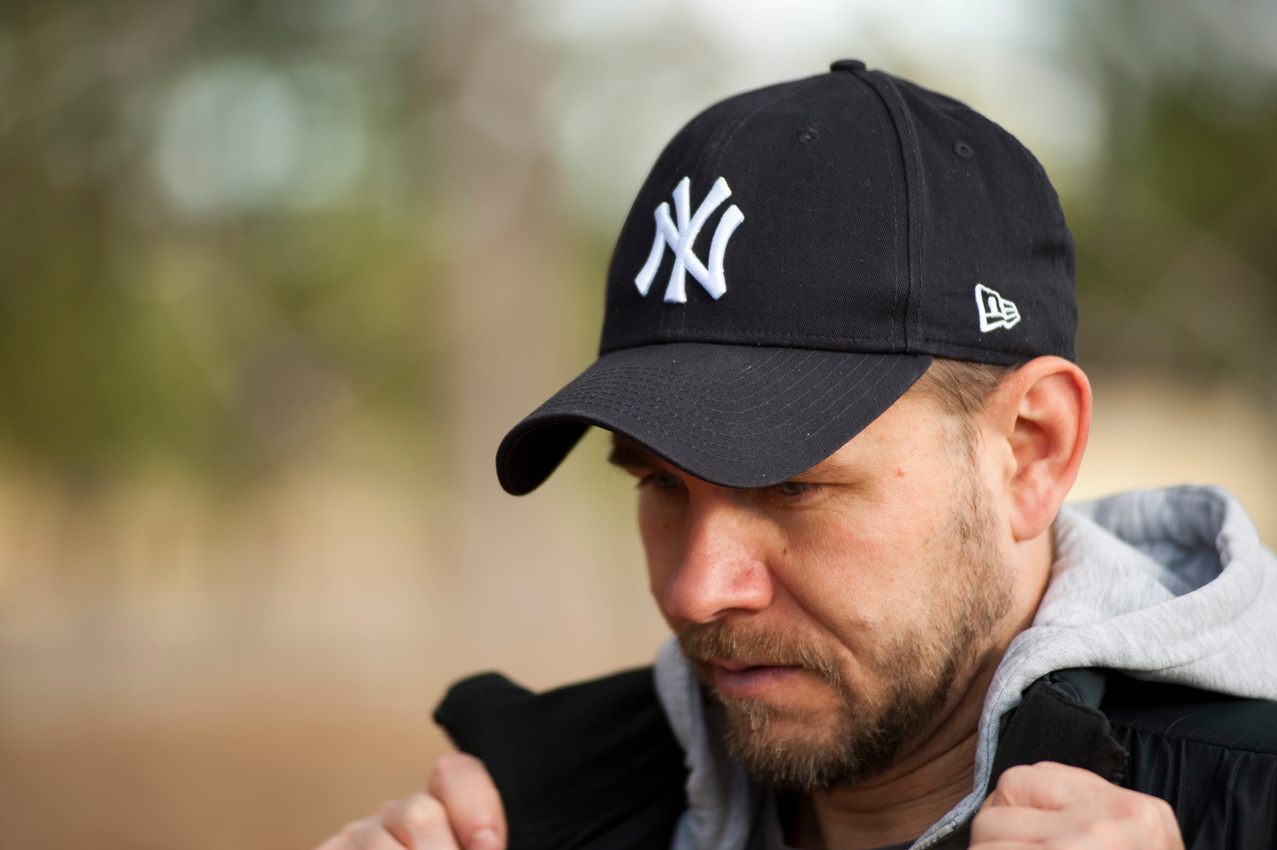 Man Wearing New York Yankees Cap