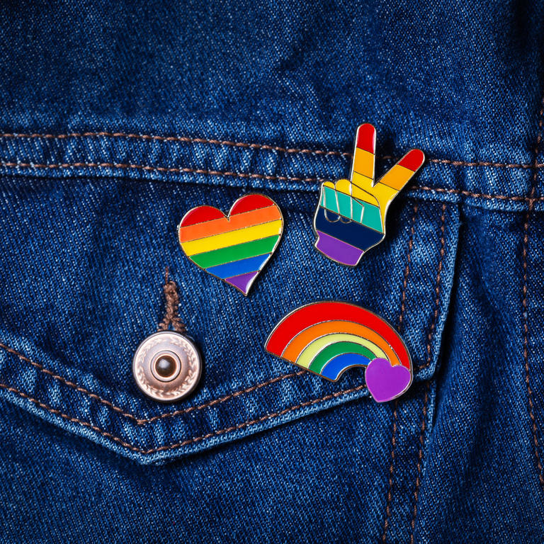 Rainbow LGBTQ Badges on Denim Closeup